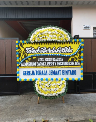Papan Bunga Duka di Naga Huta Timur